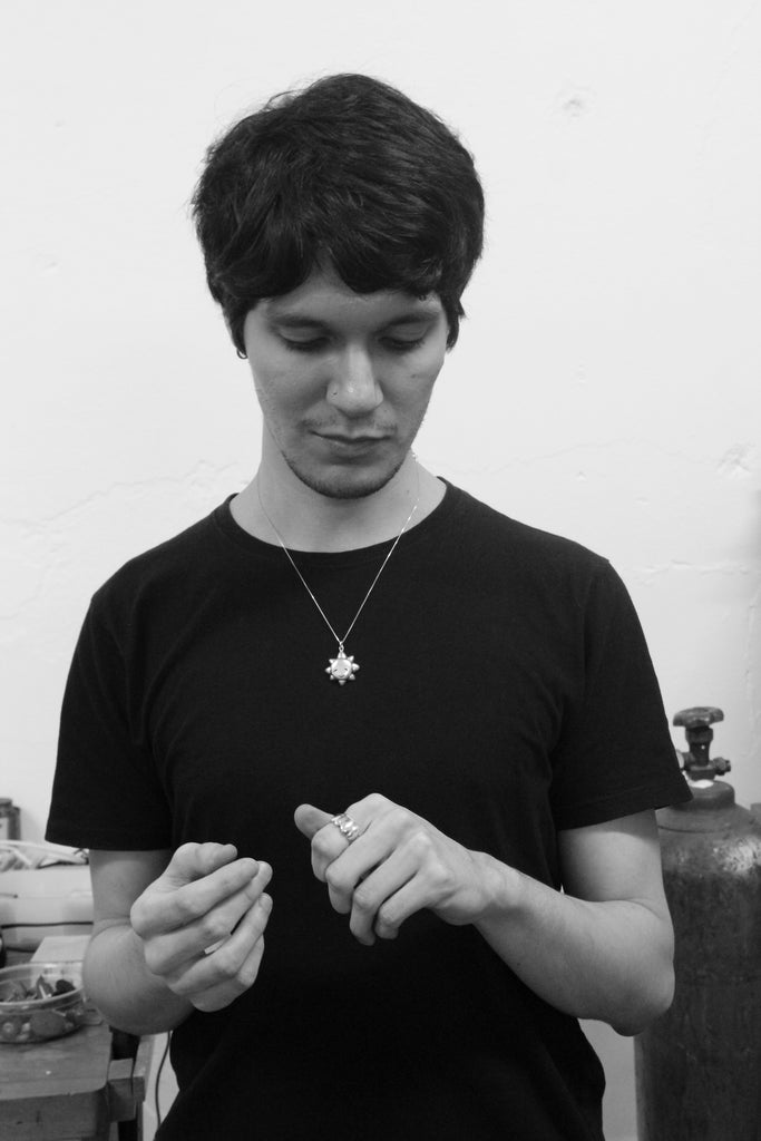 CLUB - Darío with his finished ring and sun necklace