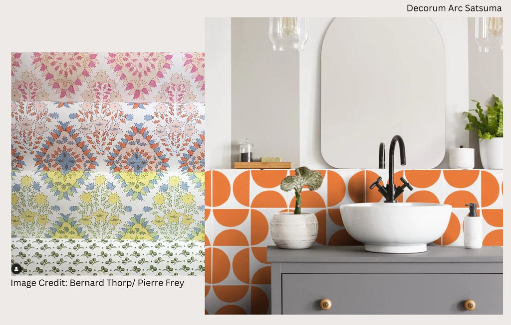 Vibrant patterned wallpaper contrasted with brightly coloured orange and white tiles