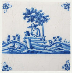 Classic blue and white delft tile with a shepherd and sheep