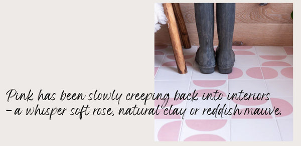 Wellington boots on a pink and white tiled floor