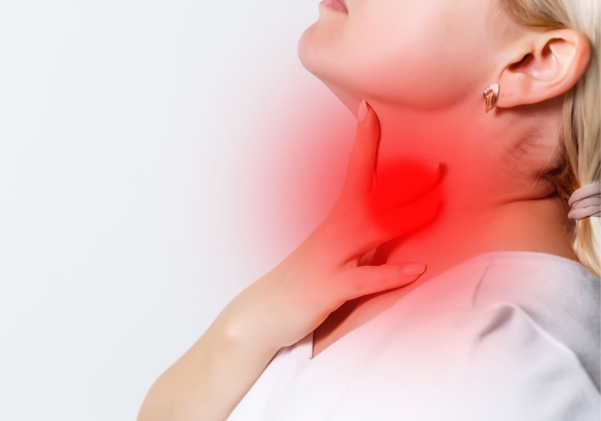 woman suffering from sore throat
