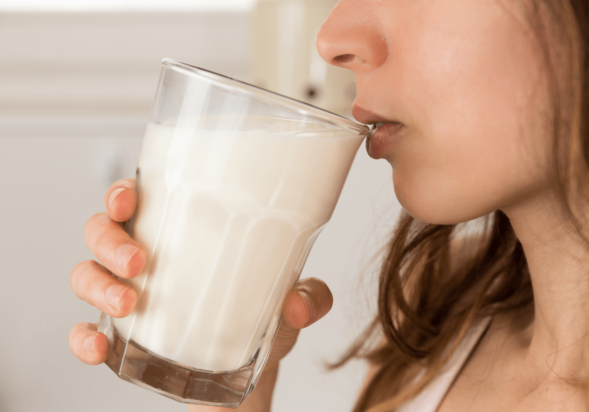 a woman drinking milk