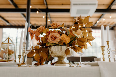 Wedding Table with Floral bouquet in Vase and candles