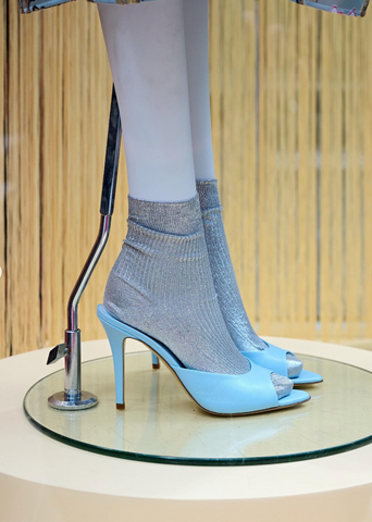 Baby blue heels on a mannequin