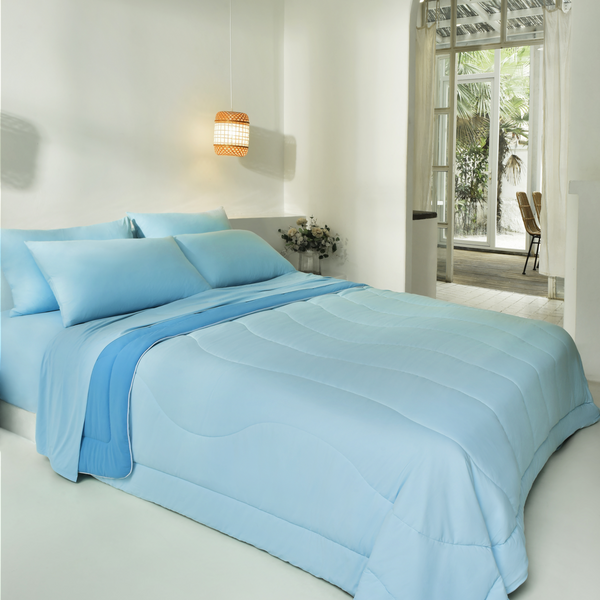 Bed made with Evercool Cooling Comforter and matching Evercool Sheet Set in aqua blue