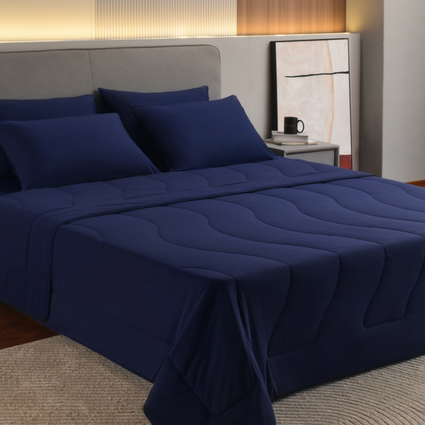 Bedroom with Rest's Evercool Cooling Comforter and matching Evercool Sheet Sets in Midnight Blue