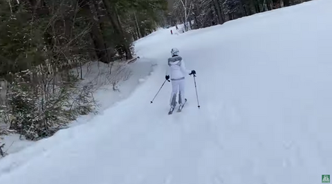 Alice skiing downhill