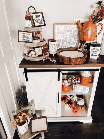 Fall farmhouse decor display with pumpkin dough bow candles