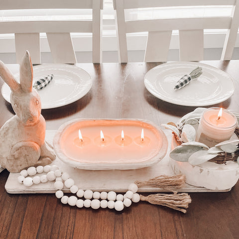 Spring tablescape with dough bowl candles as a centerpiece