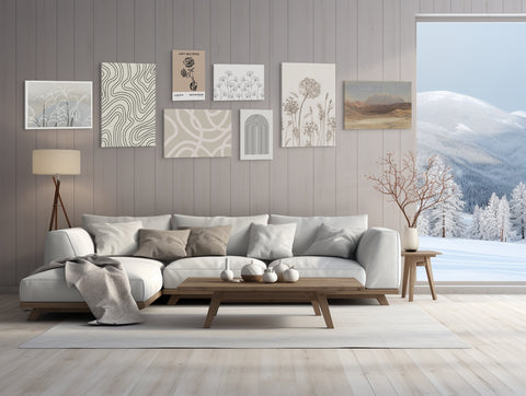 Gallery wall of canvas prints above a living room couch