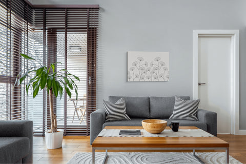 floral horizontal whelhung canvas hung above a couch in a living room