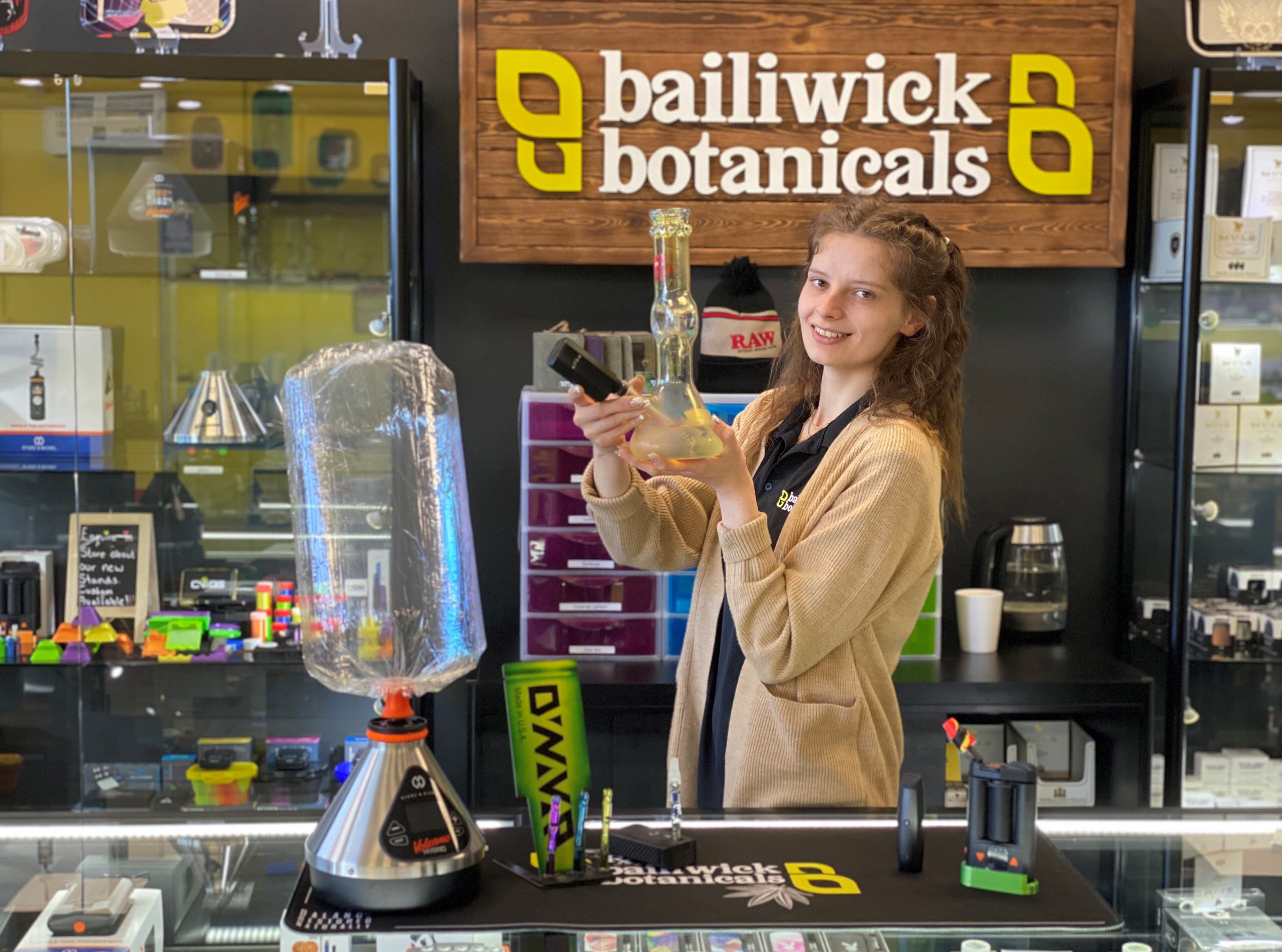 Woman Holding Glass Piece with Dry Herb Vape