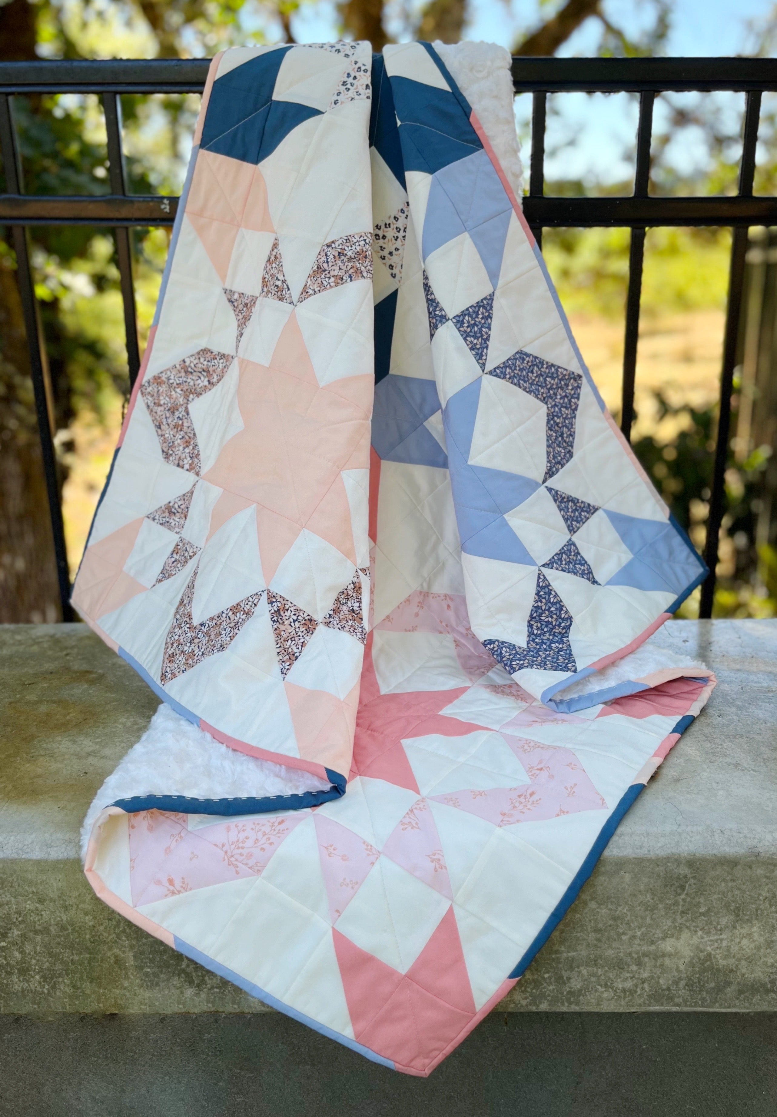 Starly Quilt made by Lauren. A modern but classic sawtooth star block quilt pattern by Cotton and Joy.