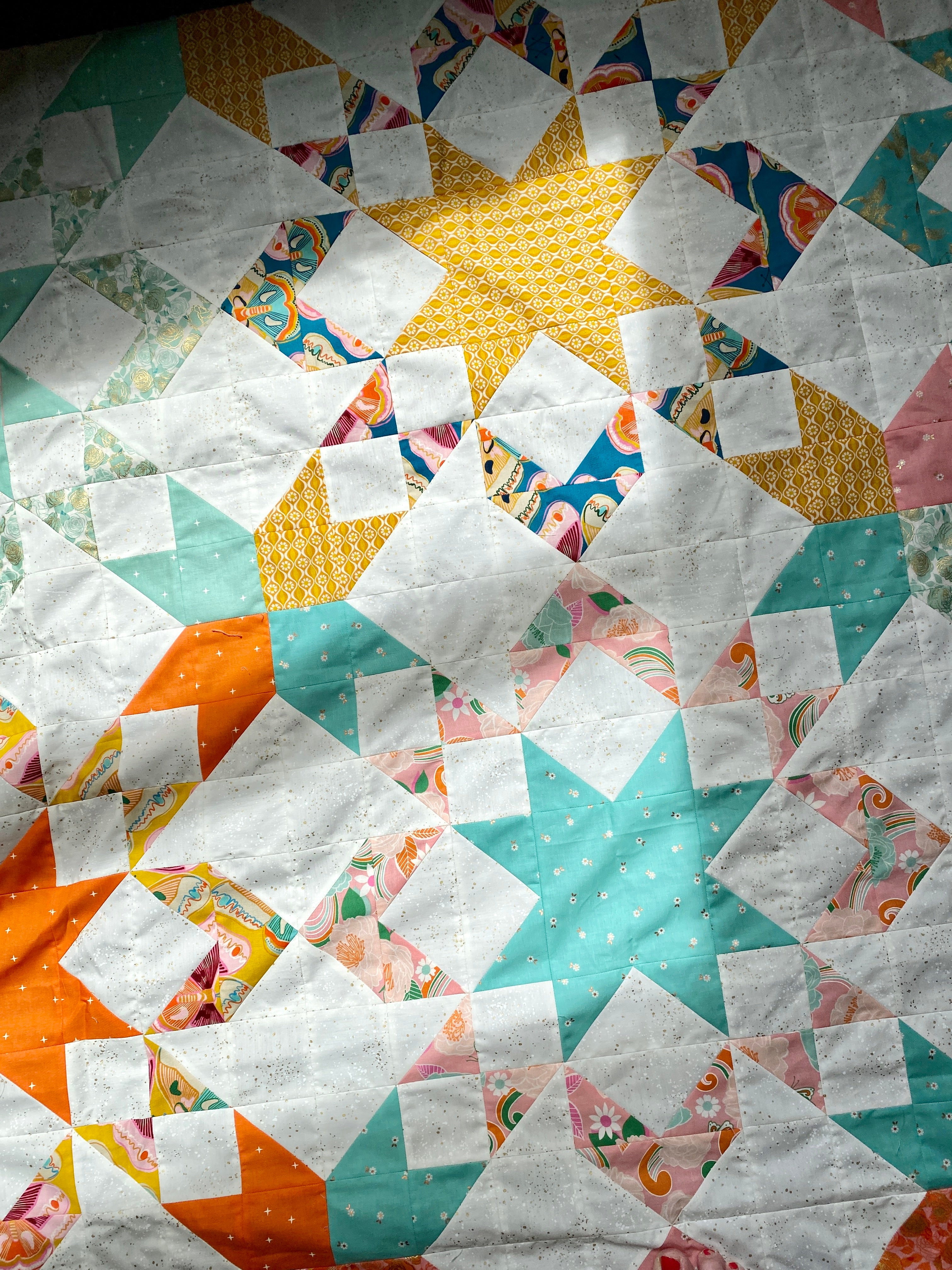Starly Quilt made by Breanna. A modern but classic sawtooth star block quilt pattern by Cotton and Joy.