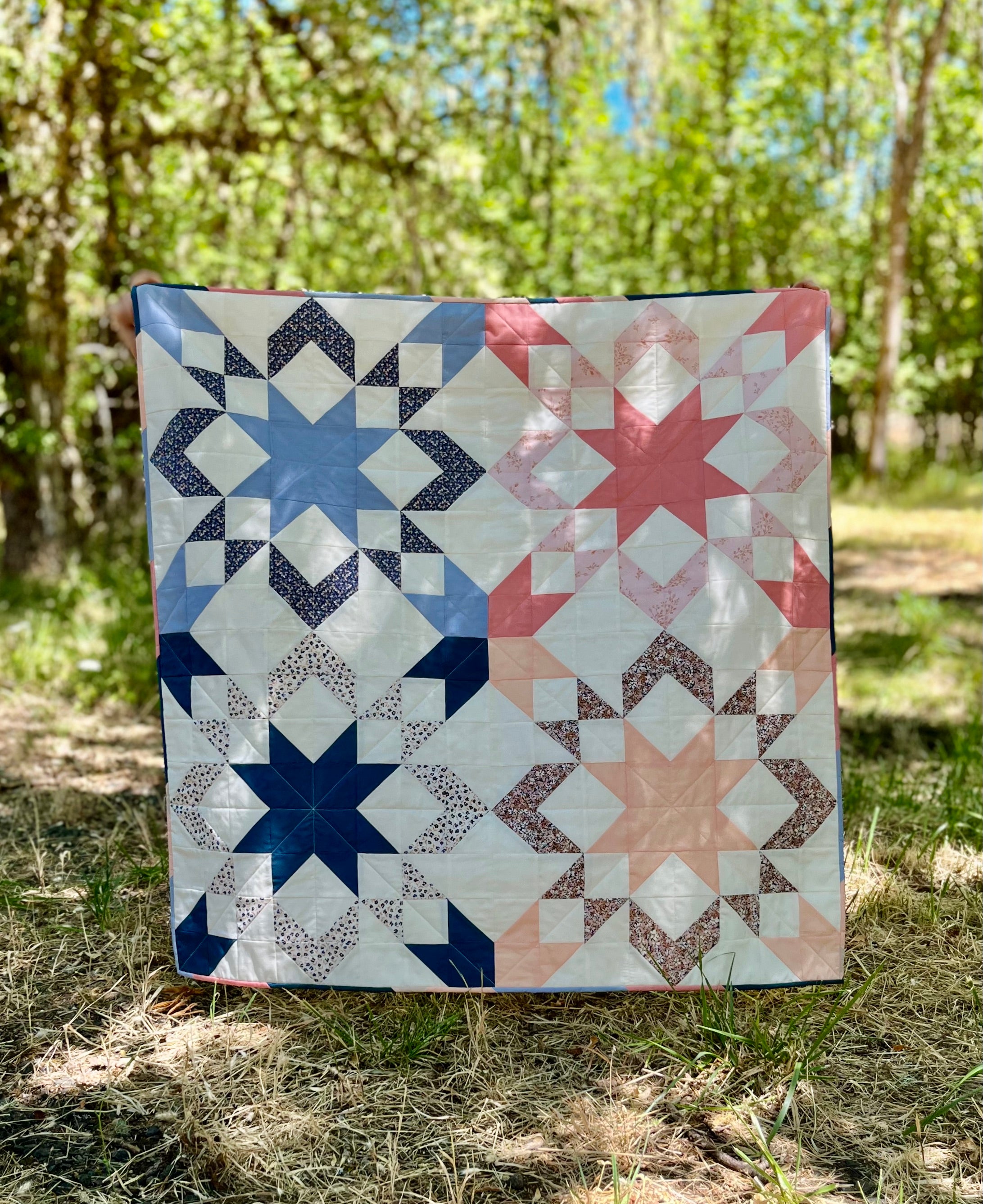 Starly Quilt made by Lauren. A modern but classic sawtooth star block quilt pattern by Cotton and Joy.