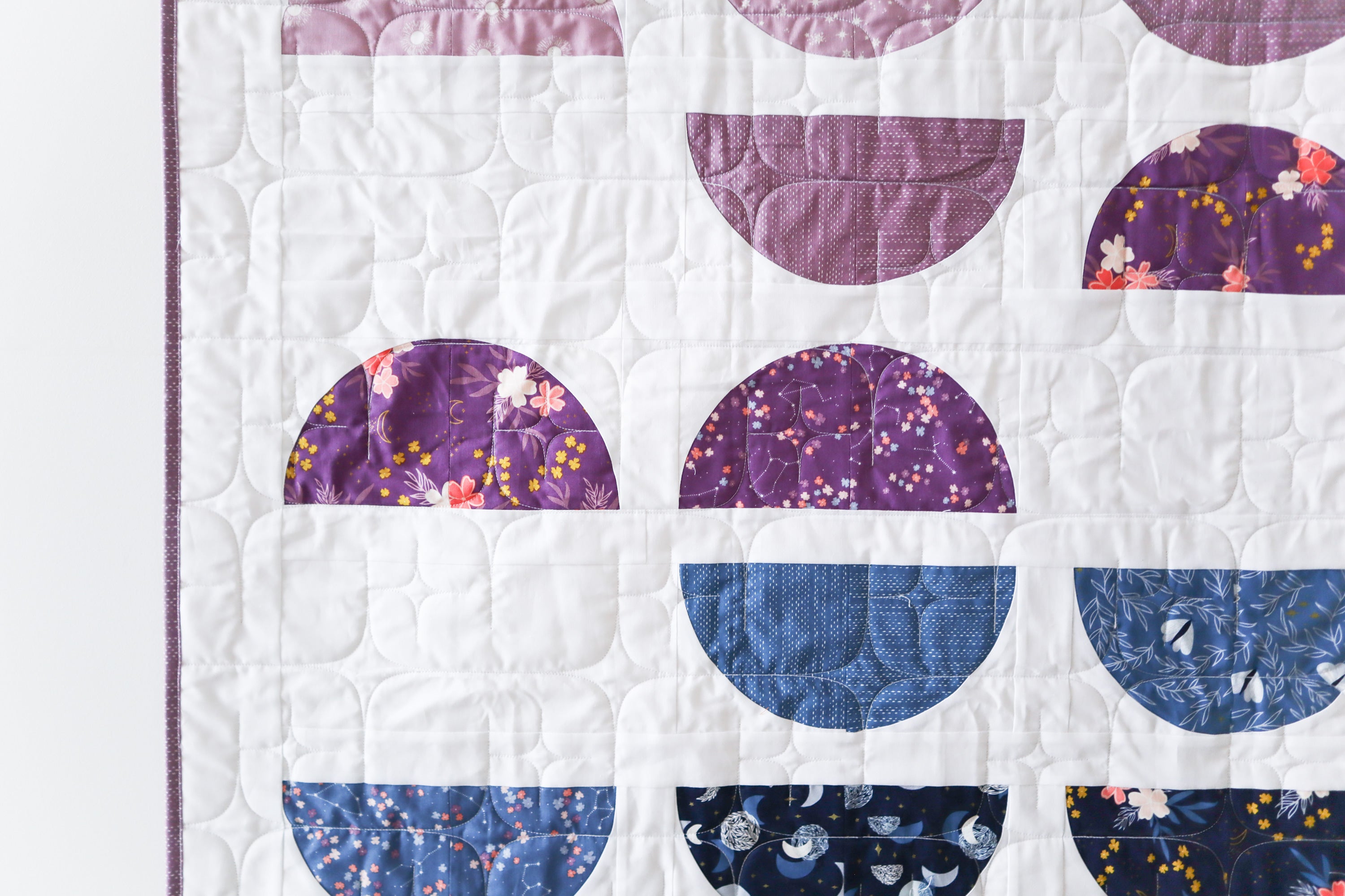 Crescent II Quilt Pattern by Cotton and Joy. A modern quilt pattern, layer cake friendly and perfect for highlighting your favoriie prints