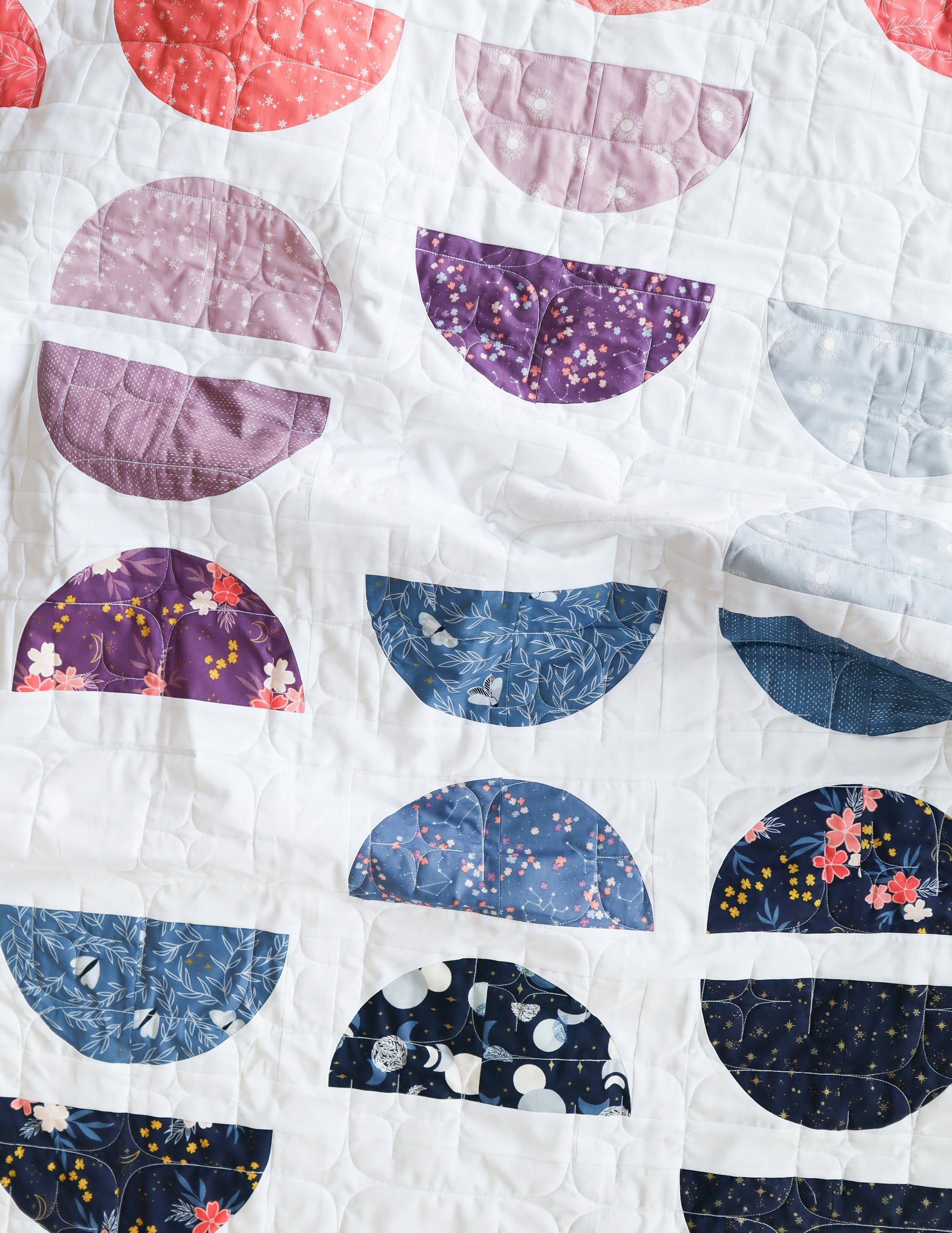 Crescent II Quilt Pattern by Cotton and Joy. A modern quilt pattern, layer cake friendly and perfect for highlighting your favoriie prints.