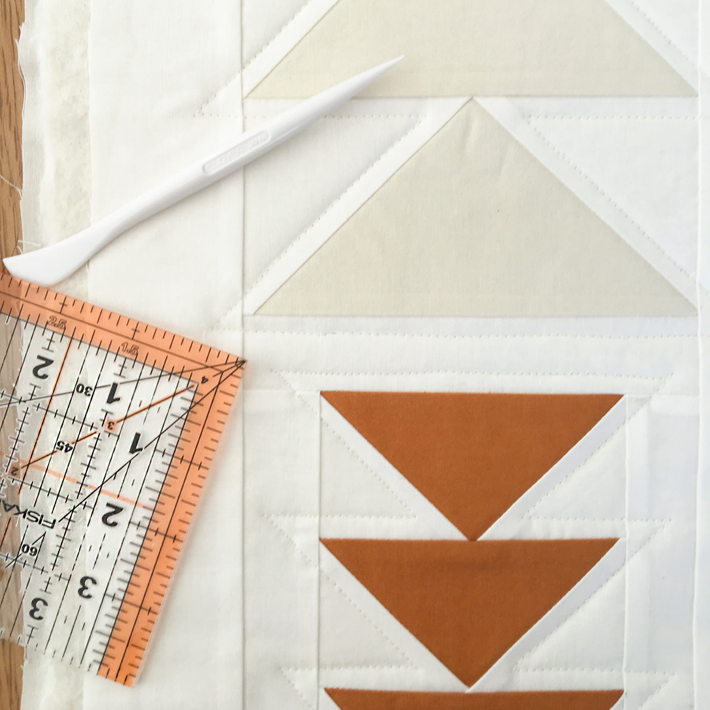 Using the hera marker by clover and ruler to mark quilting lines for straight line quilting