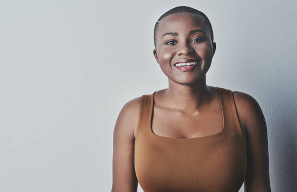 Bald lady smiling for a portrait picture