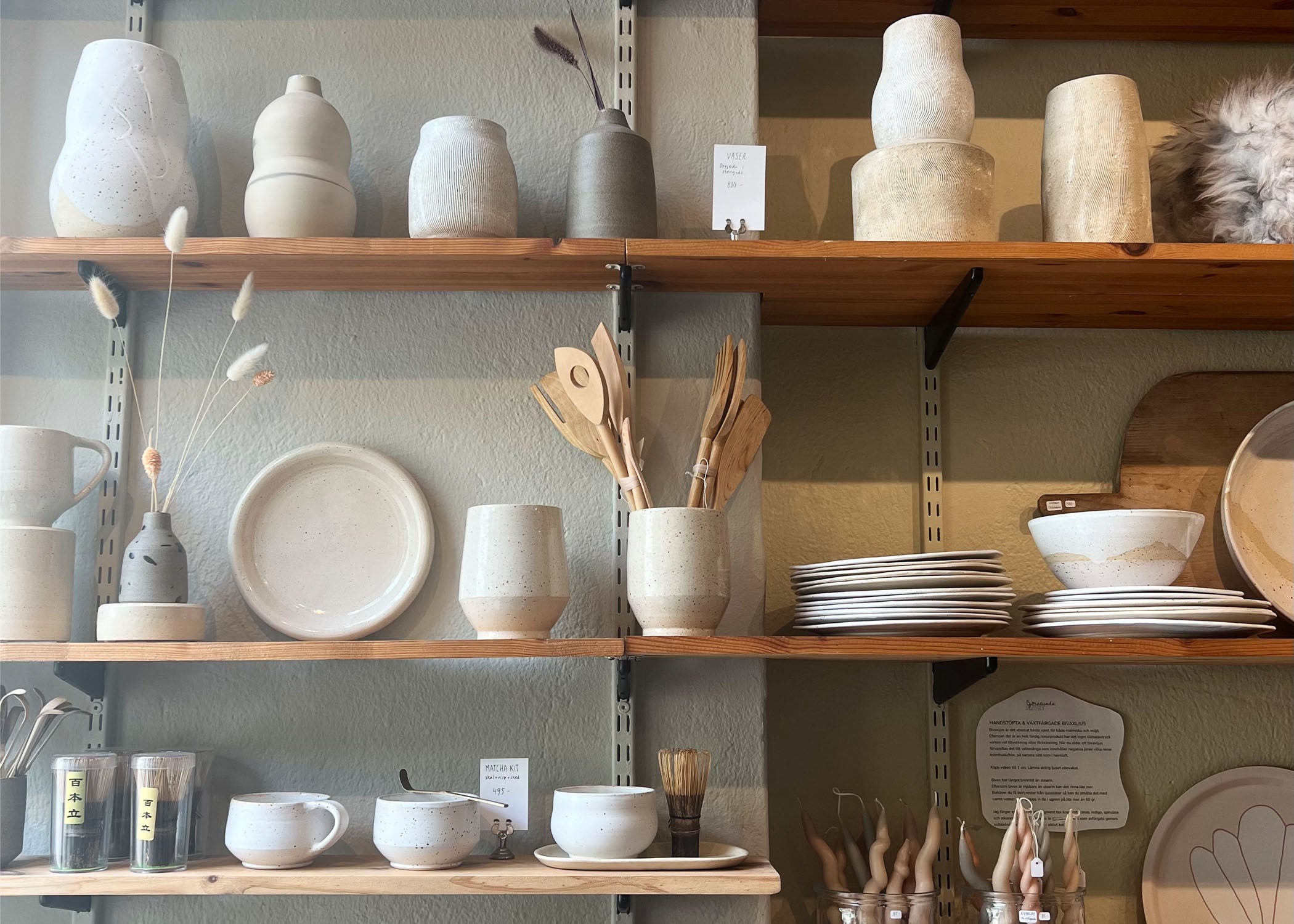 Shelves with ceramics by Erika Petersdotter found in her storefront in Stockholm, Sweden.