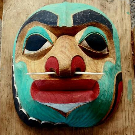 The Changing of the tides carved alder wood mask carved and crafted by Fred Fulmer Tlingit Artist on a wooden tripod