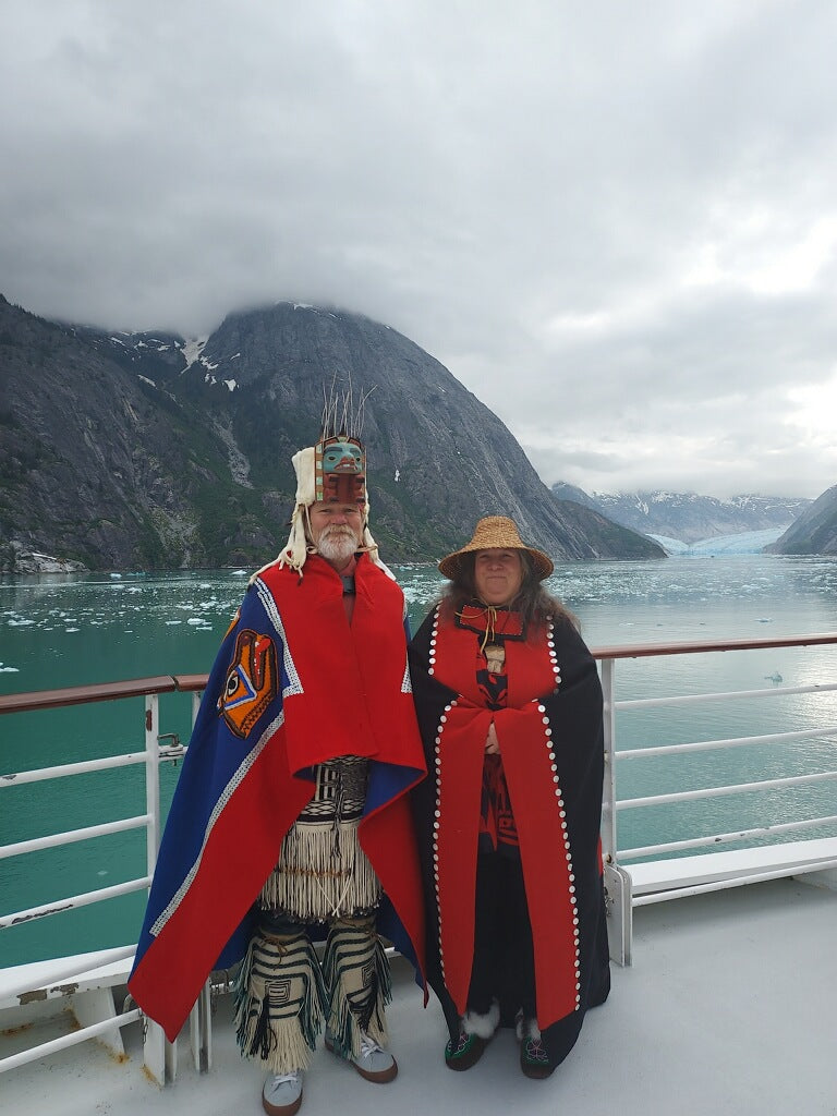 Fred Fulmer and Ivy Fulmer at the bow of a cruise ship sailing through the Glacier fields in Glacier Bay Alaska