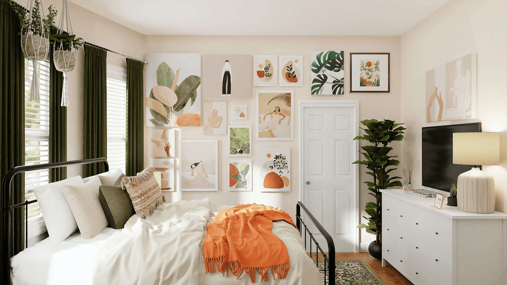 White bedroom with green, orange, wall art, and plant decor accents