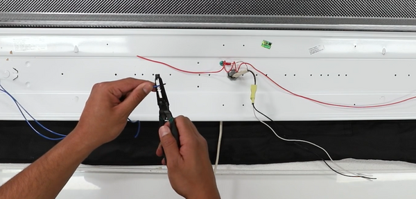 stripping wires with wire stripper