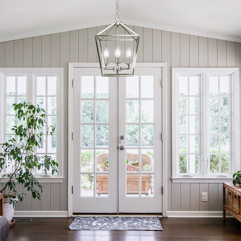 white entryway with chandelier