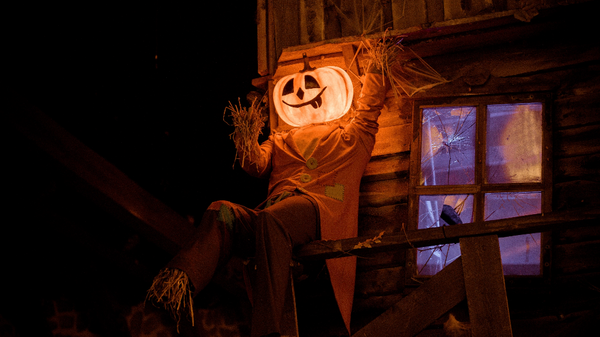 Glowing jack-o-lantern scarecrow