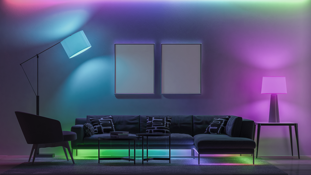 Living room with couch, table and lamps glowing in rainbow pastel colors.