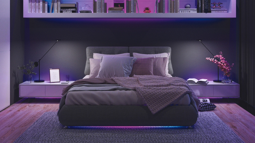 Gray bedroom with colorful pink, blue, and purple lights.