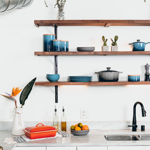 white kitchen with wood shelves