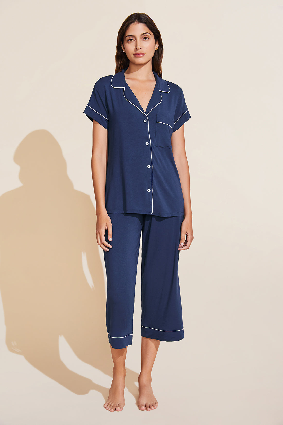 Model wears Gisele TENCEL™ Modal Short Sleeve Cropped PJ Set in navy/ivory.