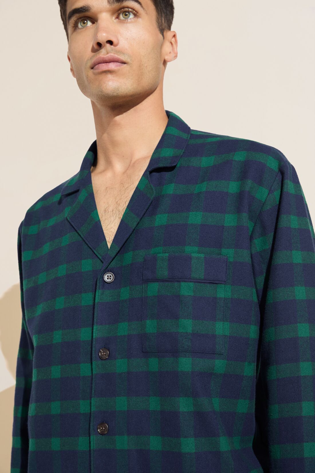 Model wears Mens Flannel Long PJ Set in navy and green plaid.