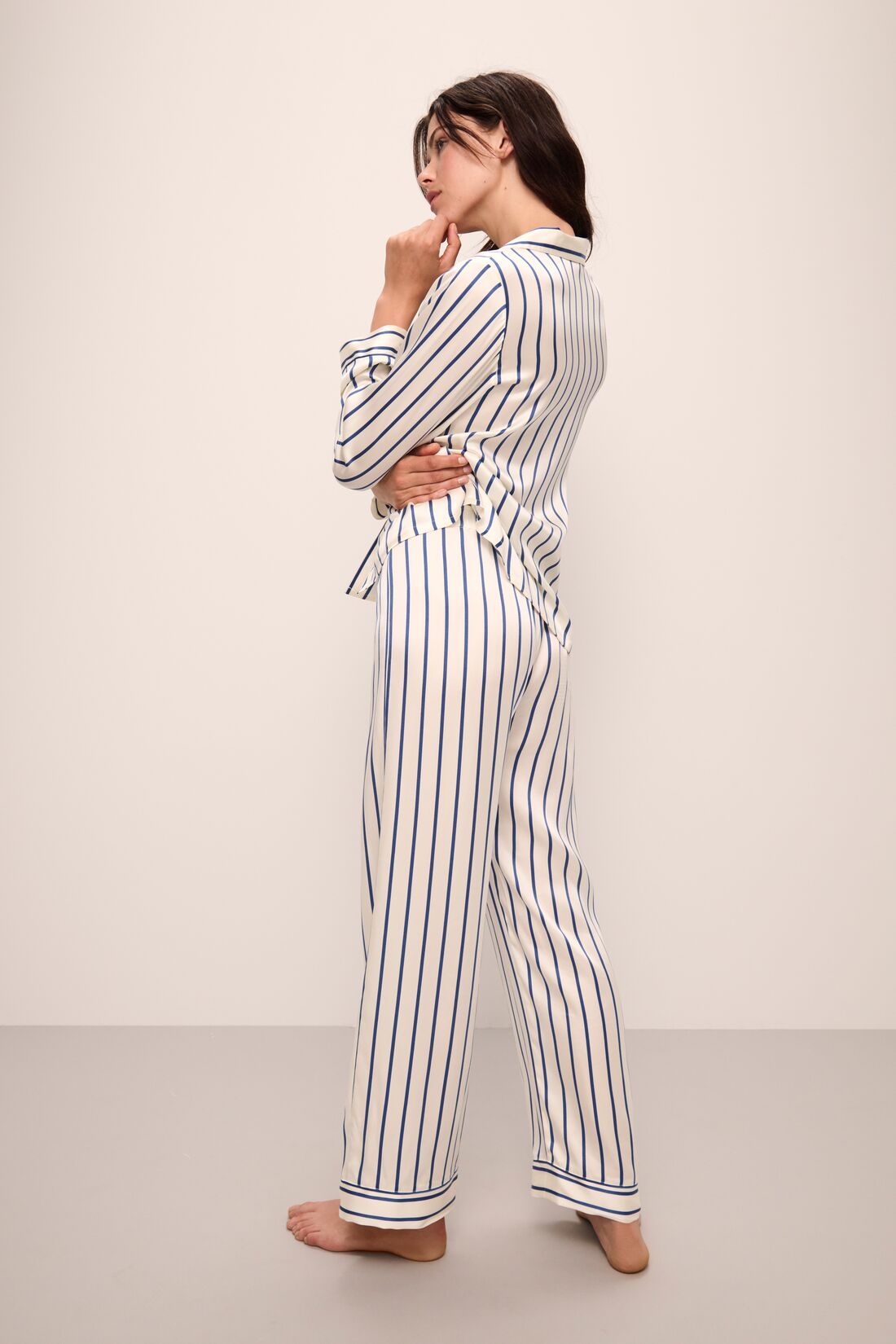 Model wears Inez Washable Silk Printed Long PJ Set in Classic Stripe Ivory/Denim Blue.