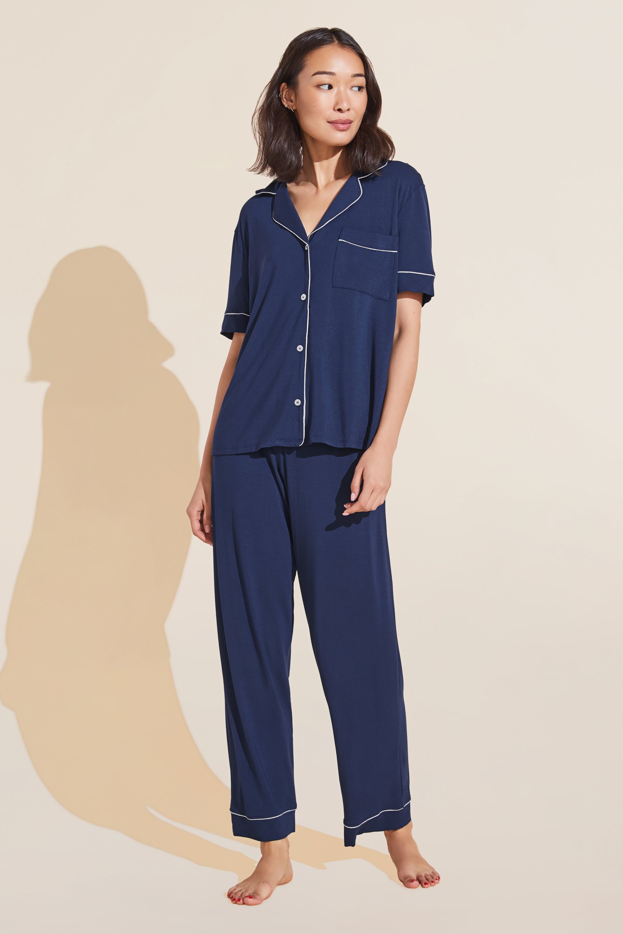 Model wears Gisele TENCEL™ Modal Short Sleeve & Pant PJ Set in navy/ivory.