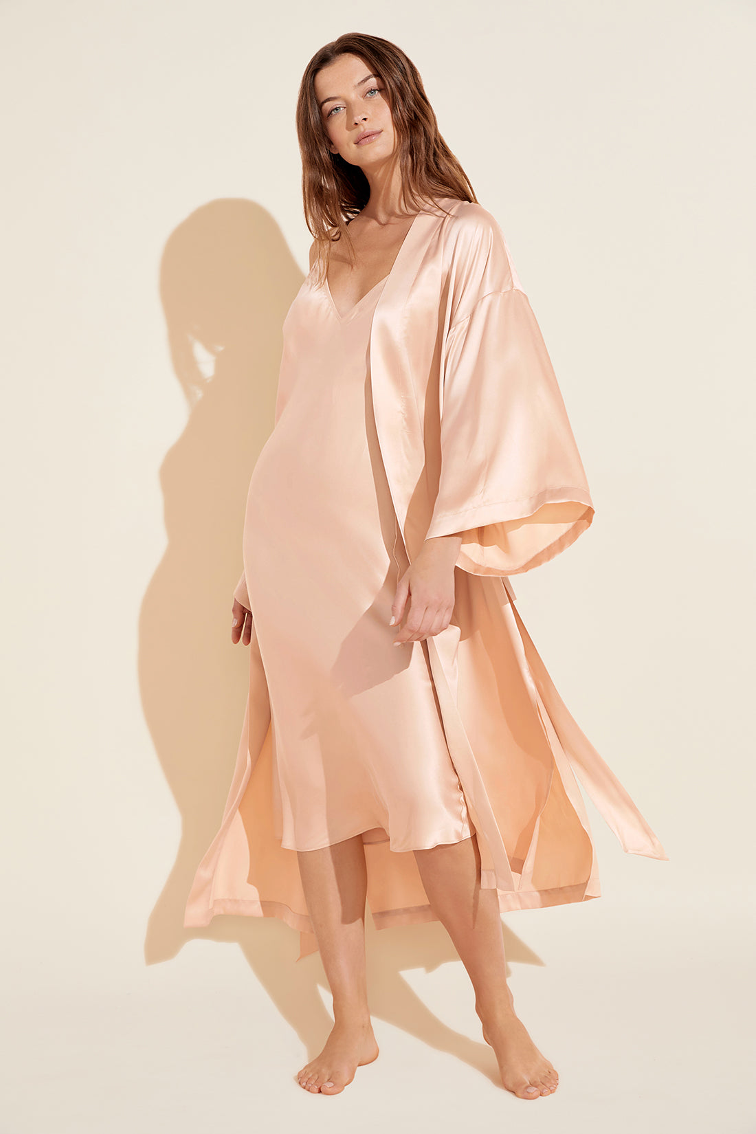 Model wears Inez Washable Silk Slip Dress in rose cloud.