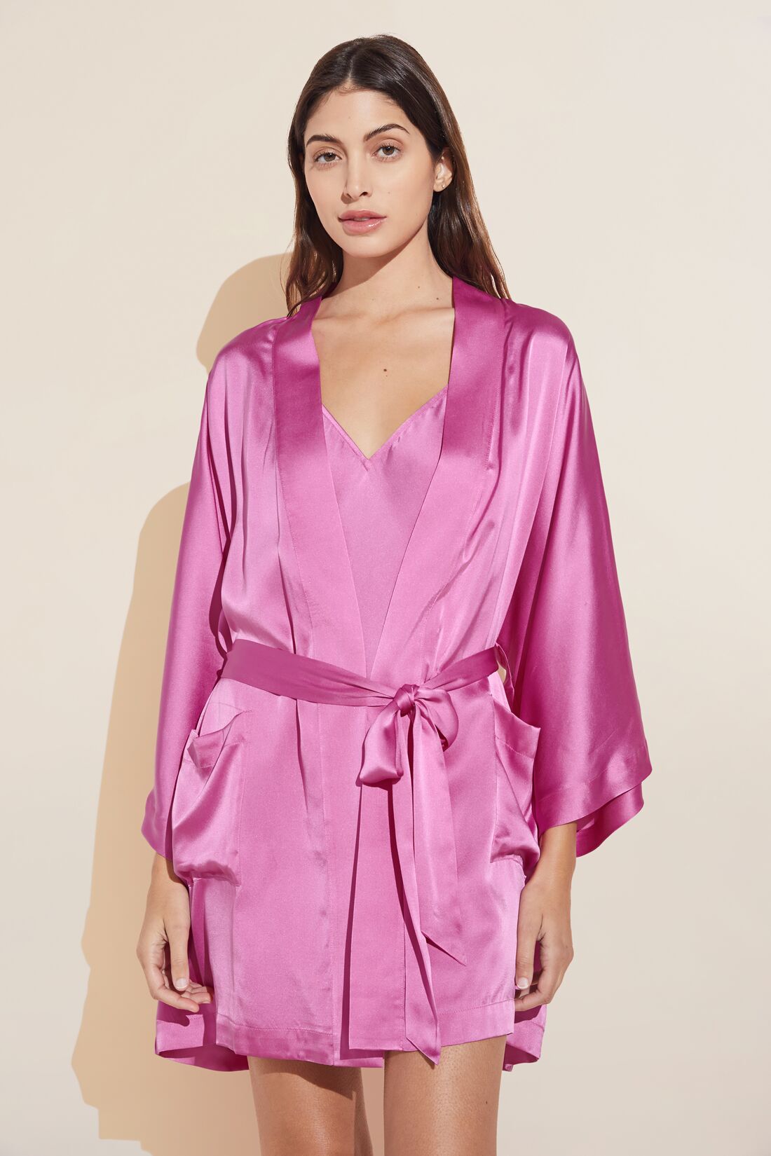 Model wears Inez Washable Silk Short Robe in italian rose.