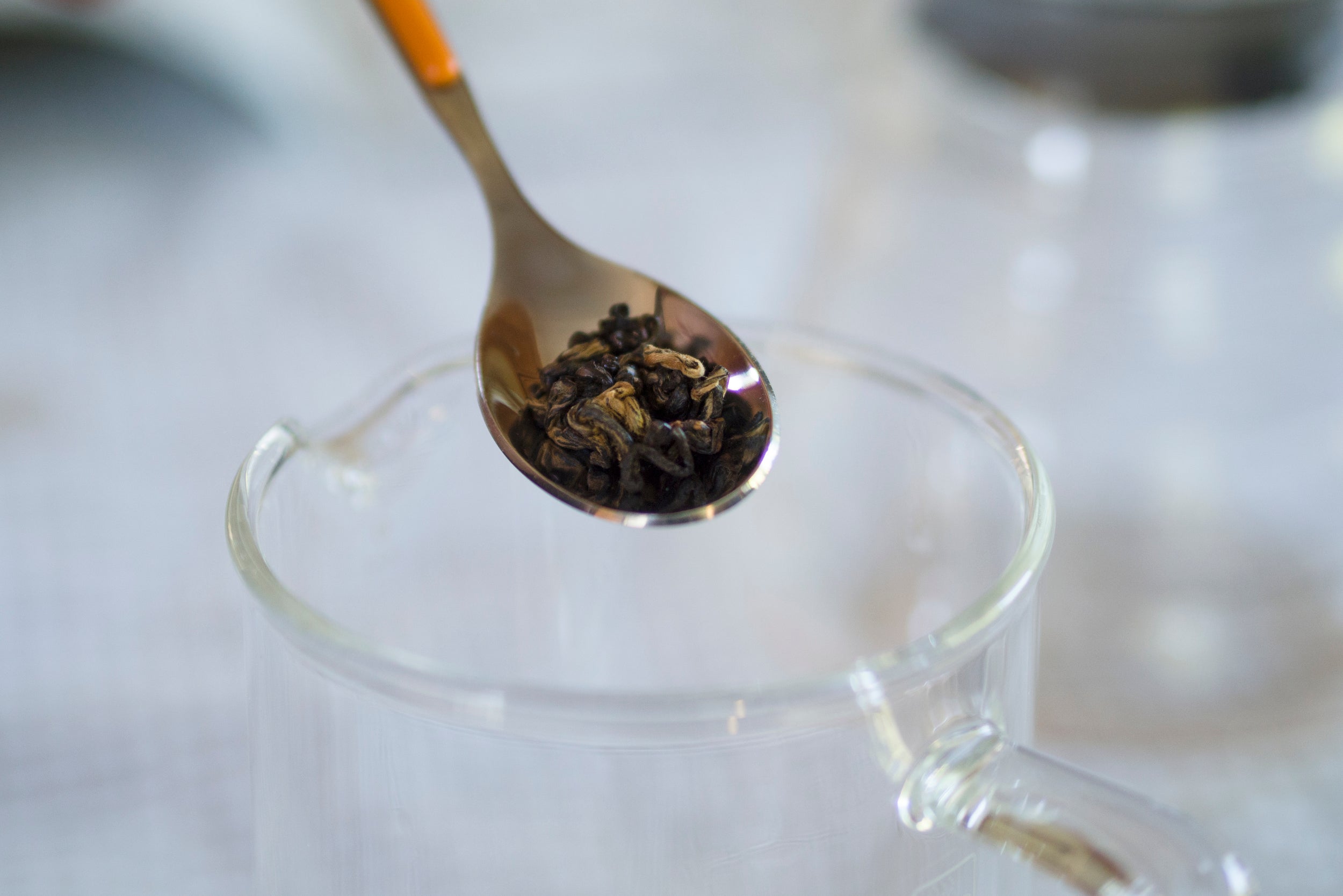 Spoon with tea leaves