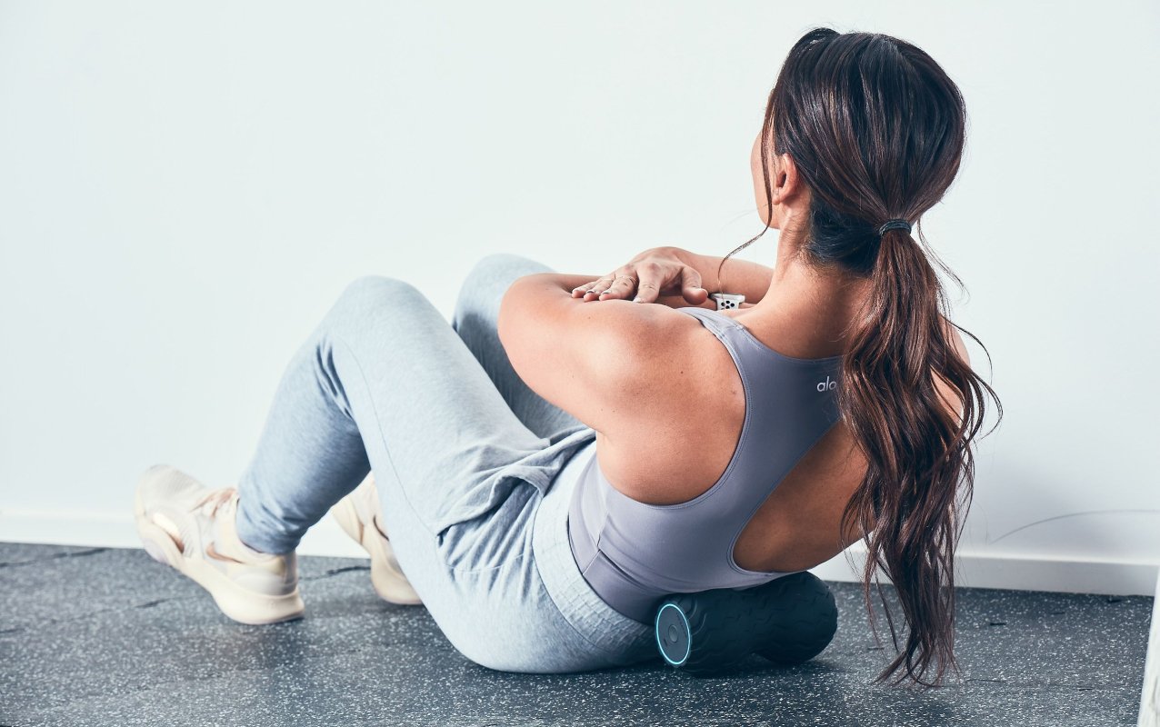 The Therabody Wave Duo's contoured shape comfortably applies pressure to the peaks and valleys of the back muscles on either side of the spine.