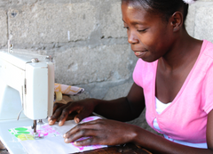 African woman sewing