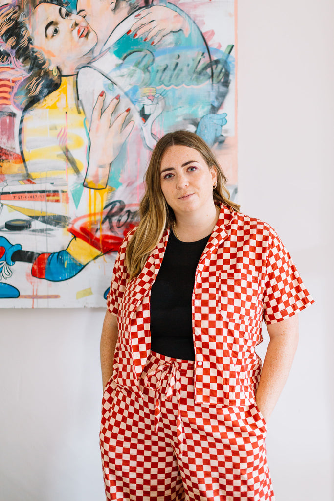 Olivia Tripp - Founder of Weekend IN wearing red and white checkerboard co-ord