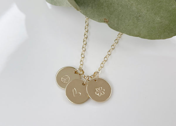 Personalised Jewellery featuring the small discs with personalised symbols.