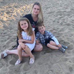 Leanne on the beach with her two kids