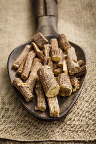 Close-up image of licorice root, showcasing its natural properties for holistic wellness, including soothing skin conditions and boosting immune health.