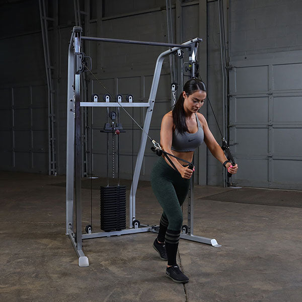 Functional Trainer With Woman Doing a Chest Fly