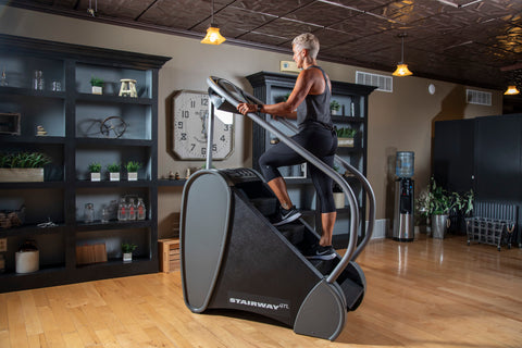 Jacobs Ladder STairway GTL Living Room view with older woman using it the machine