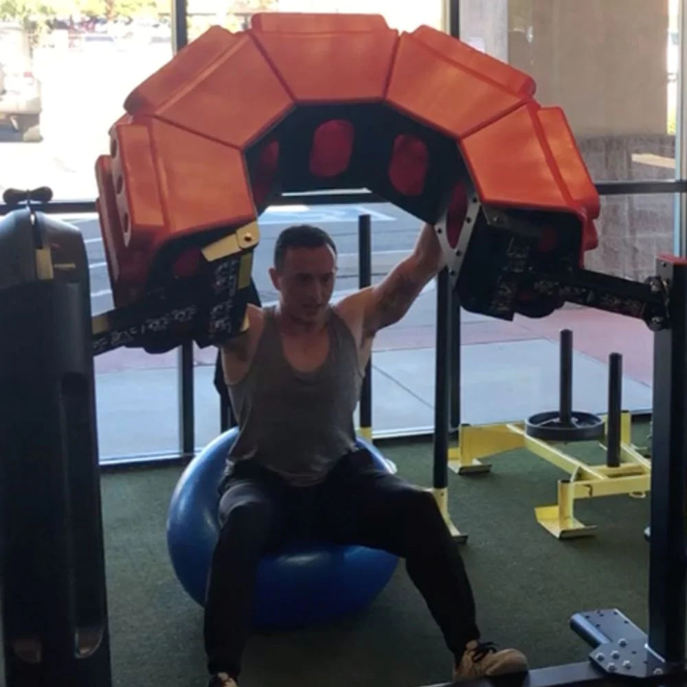 Marpo Tire Flip in Use With Man On Exercise Ball