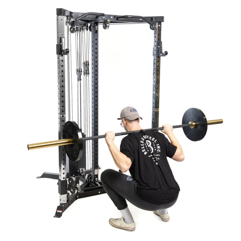 Bells of steel all in one trainer squat rack view with main doing barbell squat